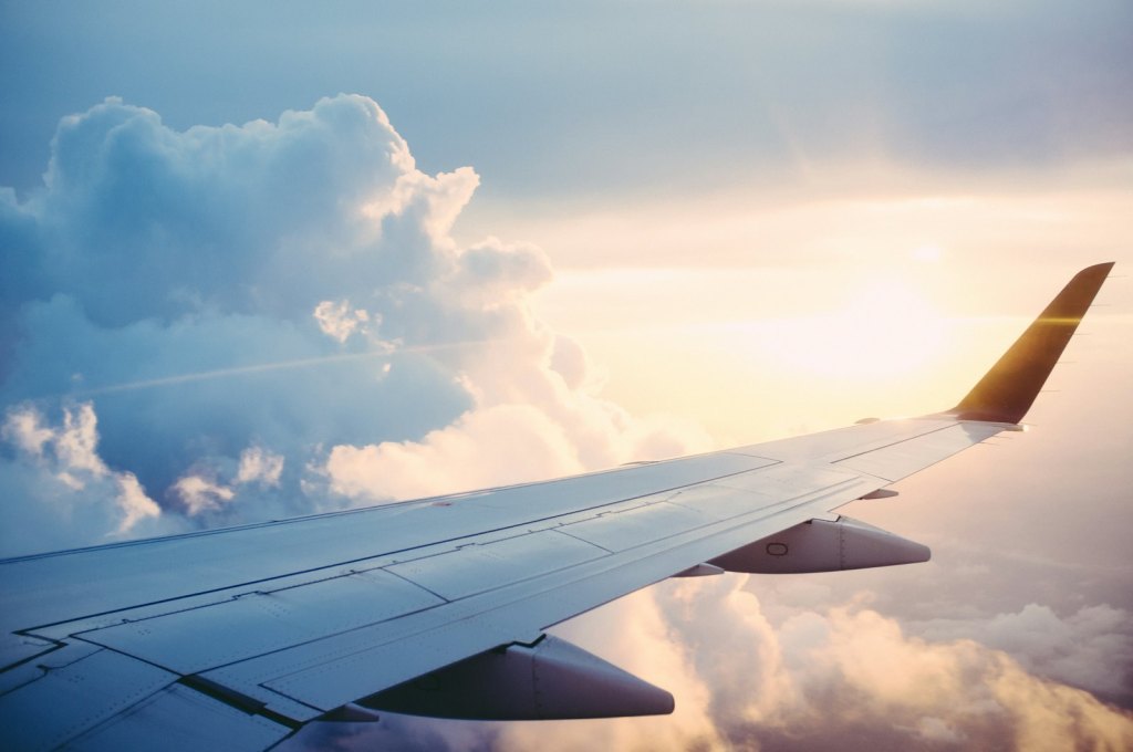 Commercial airliner flying above the clouds