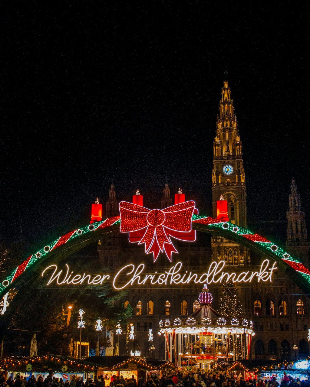 Christmas lights and market stalls in front of Vienna City Hall at Rathausplatz