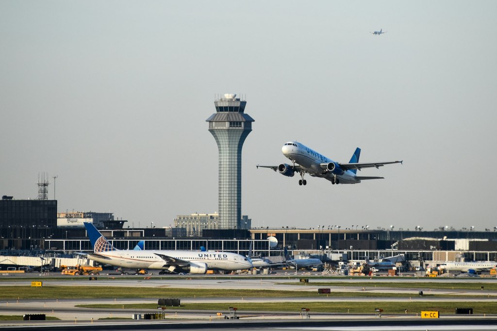 A passenger jet taking off from an airport runway