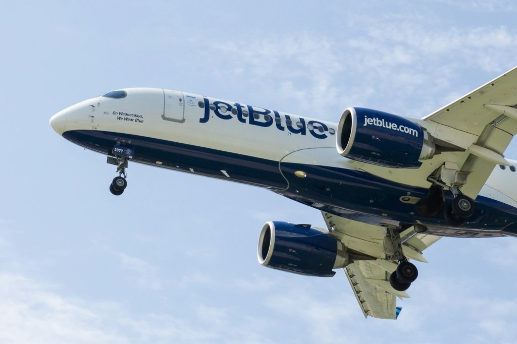 A JetBlue airplane flying in the sky