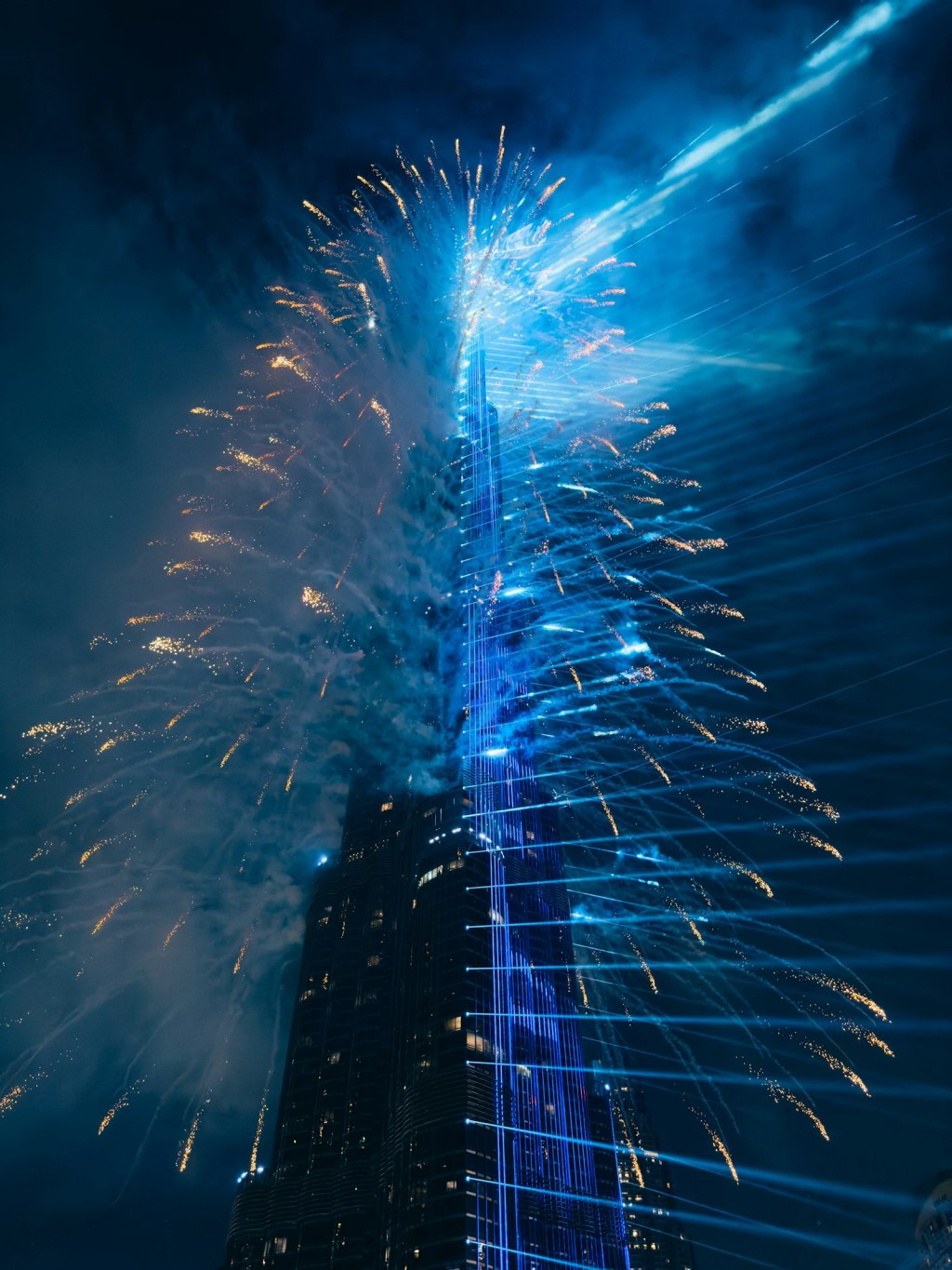 Fireworks exploding around the Burj Khalifa in Downtown Dubai at night