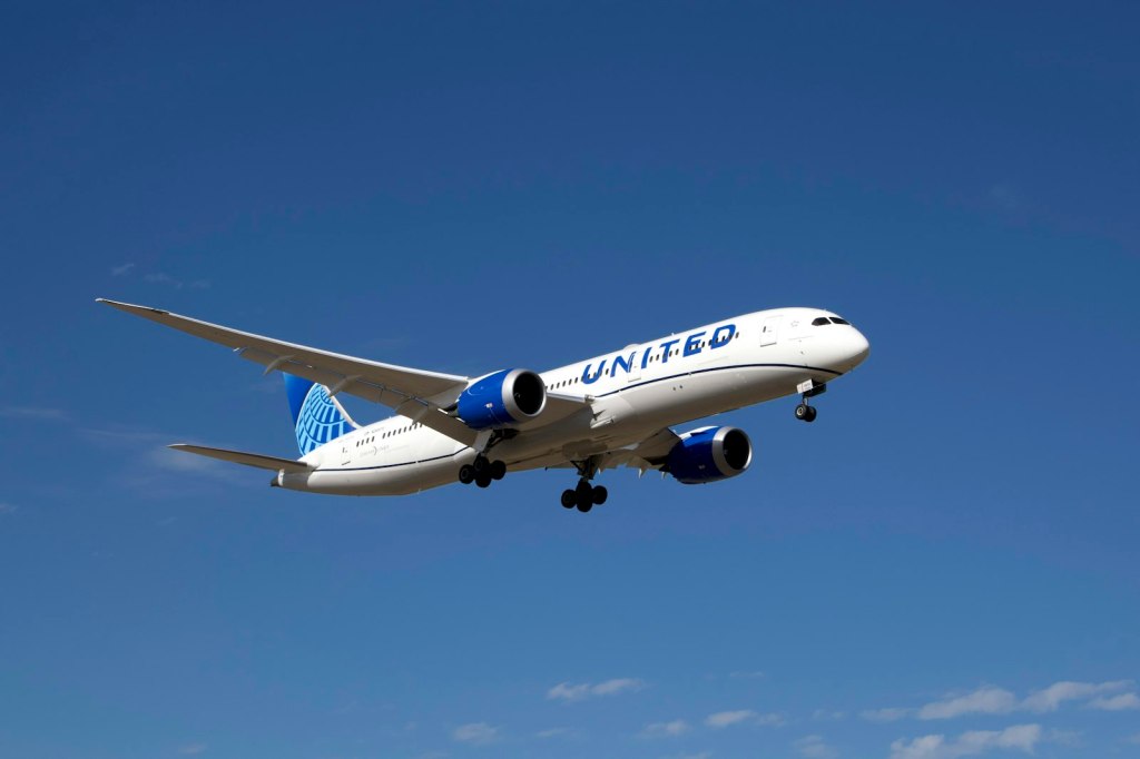 A United Airlines plane flying in the sky