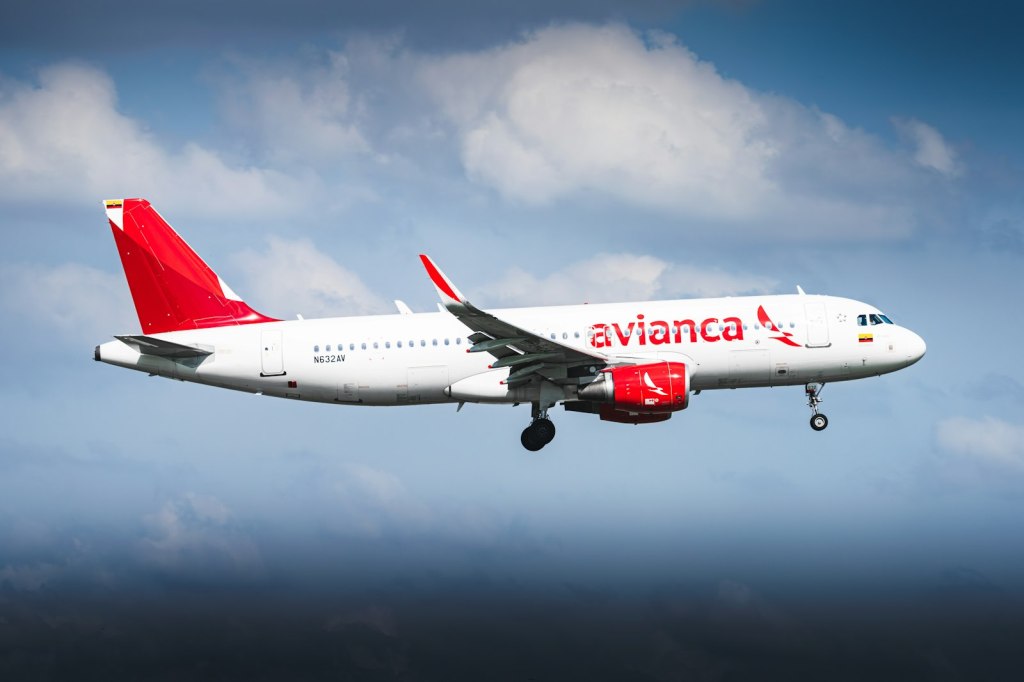 An Avianca airplane flying in the sky