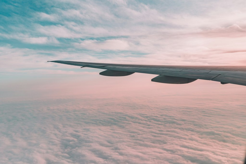 A plane flying high above the clouds